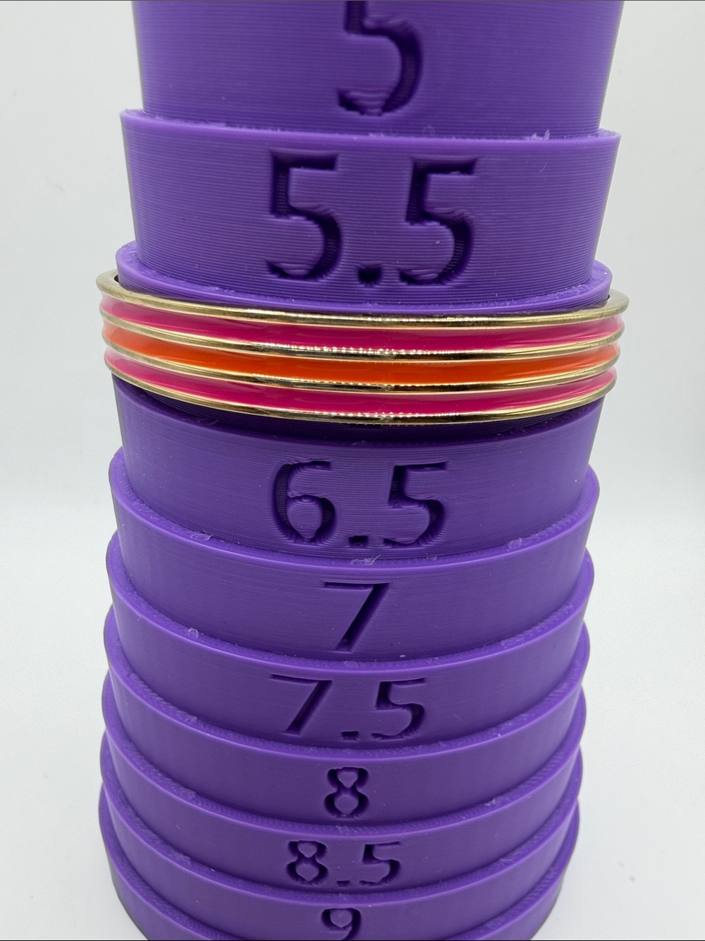 JAFRA Pink and Orange Gold-Trim Bangles